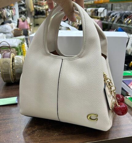 Coach - Hand bag with cherry charm